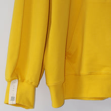Load image into Gallery viewer, Owaka Oversize Hoodie sleeve detail in Beeswax colour